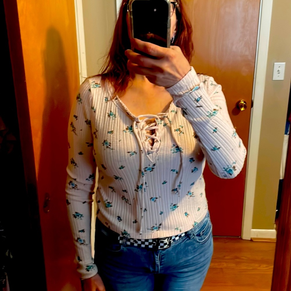 Juniors light pink with flowers shirt.